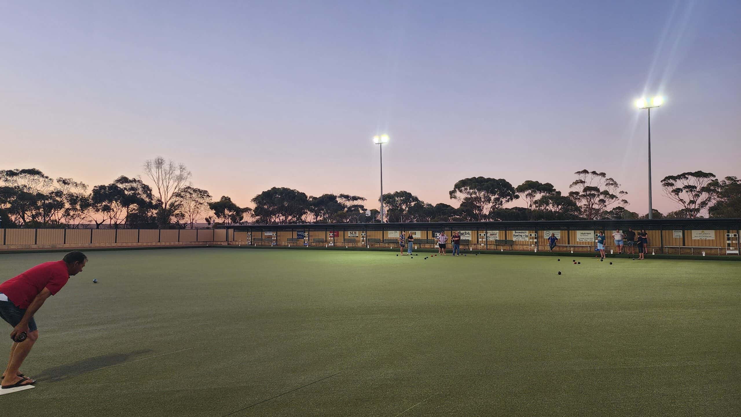 DaveFavicon40x40px512x512px People playing barefoot bowls at Bruce Rock sports ground during evening.
