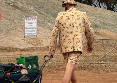 Person walking outdoors pulling a cart with wireless internet equipment.